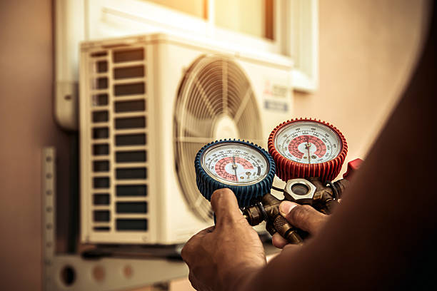 Professional Heat Pump Repair technician working in Pikesville, MD